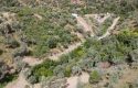 ULAMIŞTA KADASTROL YOL CEPHELİ DOĞA MANZARALI 5.500 m2 ZEYTİNLİK