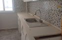 SEFERİHİSAR MERKEZİ KONUMDA ARA KAT DOĞALGAZLI KAPALI MUTFAK 3+1 KİRALIK DAİRE